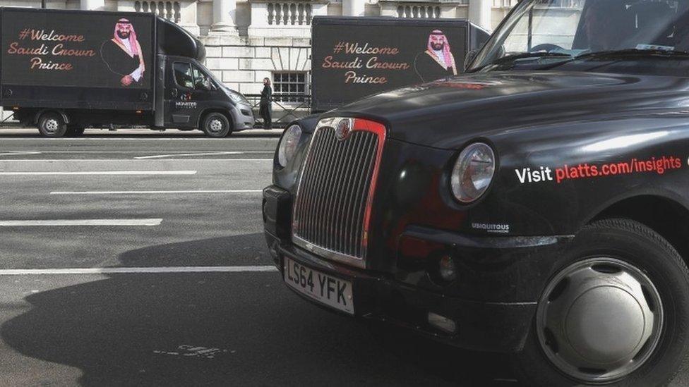 Other vans parked in Whitehall feature a welcome to the Saudi crown prince