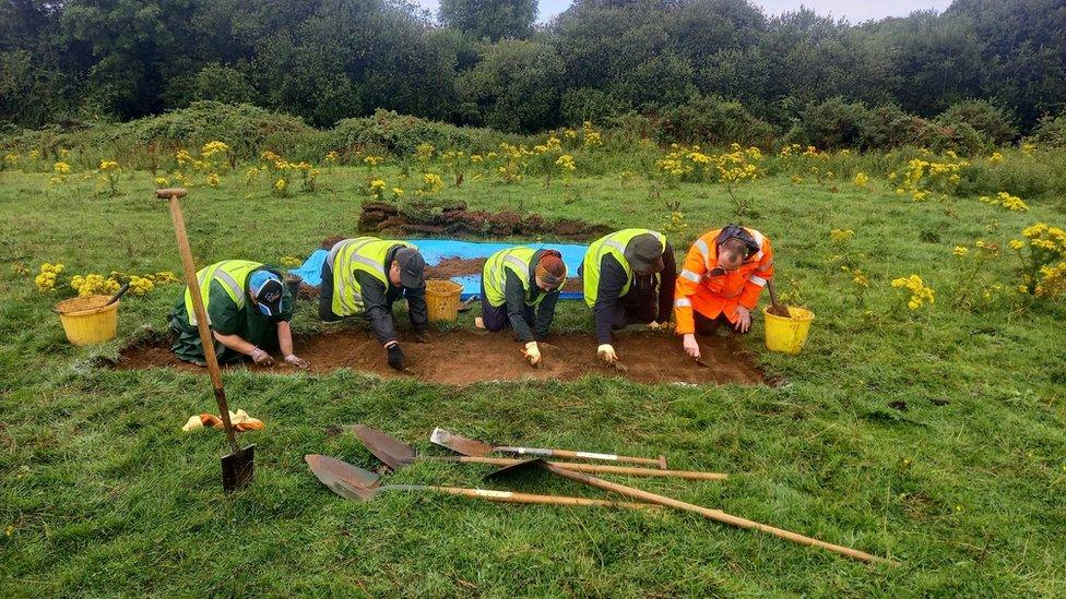 Volunteers excavating site