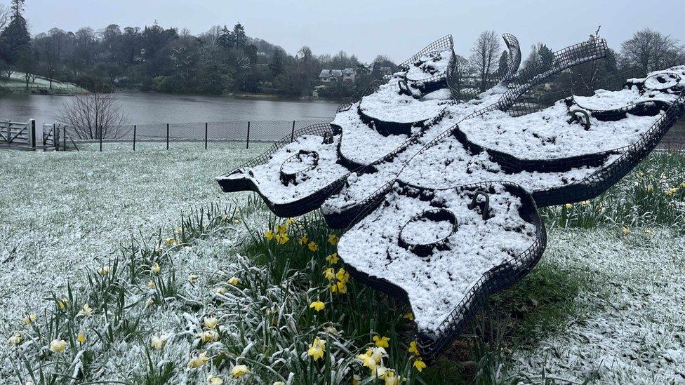 Butterfly statue covered in snow