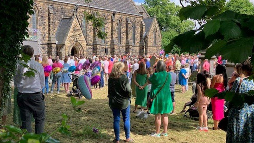 Crowds gathered outside a church