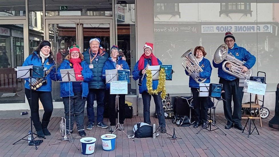 Members of the bands carolling