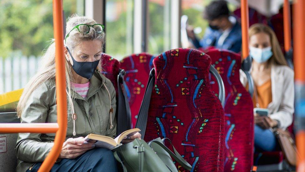 women on buses