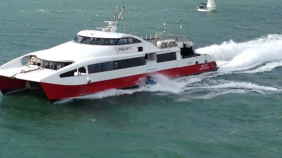 A personal watercraft crashing into a ferry