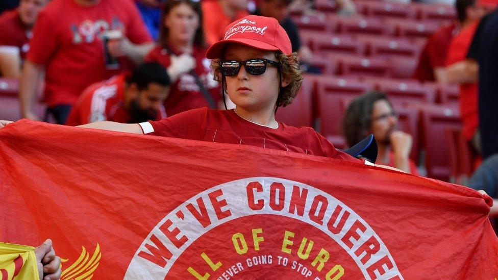 young Liverpool supporter in the crowd