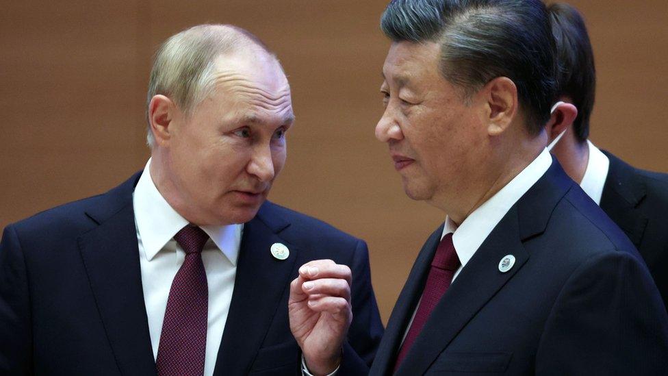 Russian President Vladimir Putin speaks with Chinese President Xi Jinping in Uzbekistan in September 2022