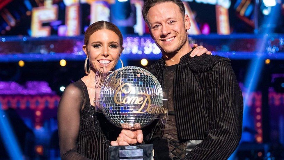 Stacey Dooley and Kevin Clifton with the Strictly Come Dancing Glitterball trophy