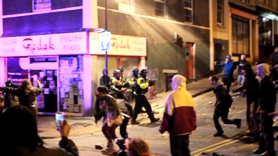 Police and rioters on Stokes Croft in Bristol in 2011