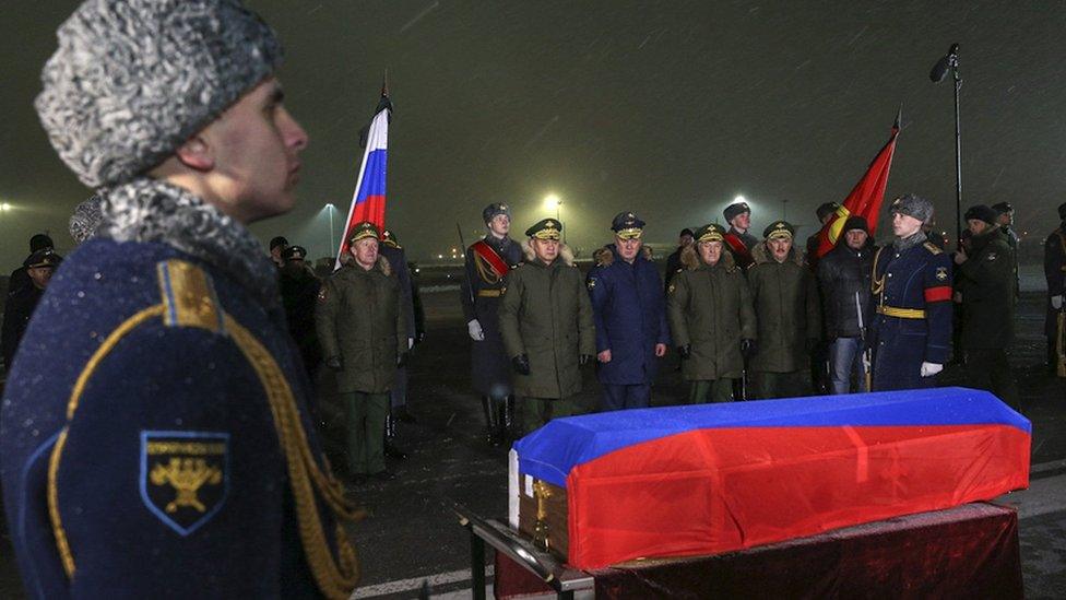 The body of Lt Col Oleg Peshkov arriving at a military airport near Moscow