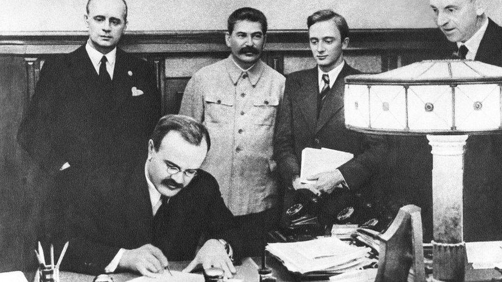 Vyacheslav Molotov signs the Non-aggression Pact between Germany and the USSR