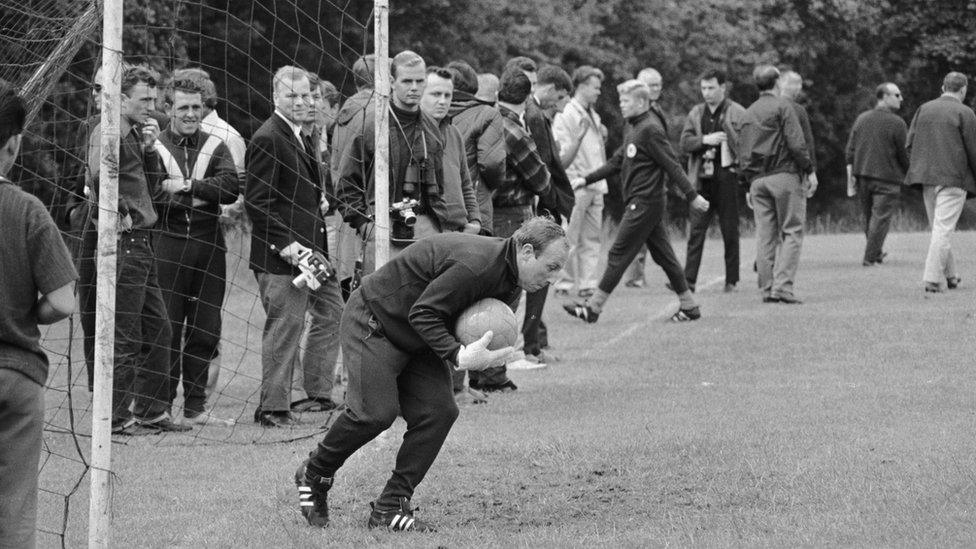 West German striker Uwe Seeler trying his hand in goal while training at Ashbourne