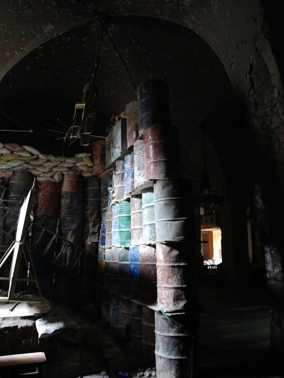 Oil drums piled five-high inside the mosque