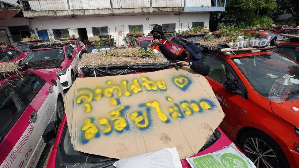 A row of abandoned taxis in Bangkok,