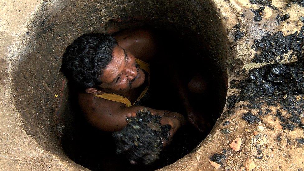 Binod Lahot in a sewer