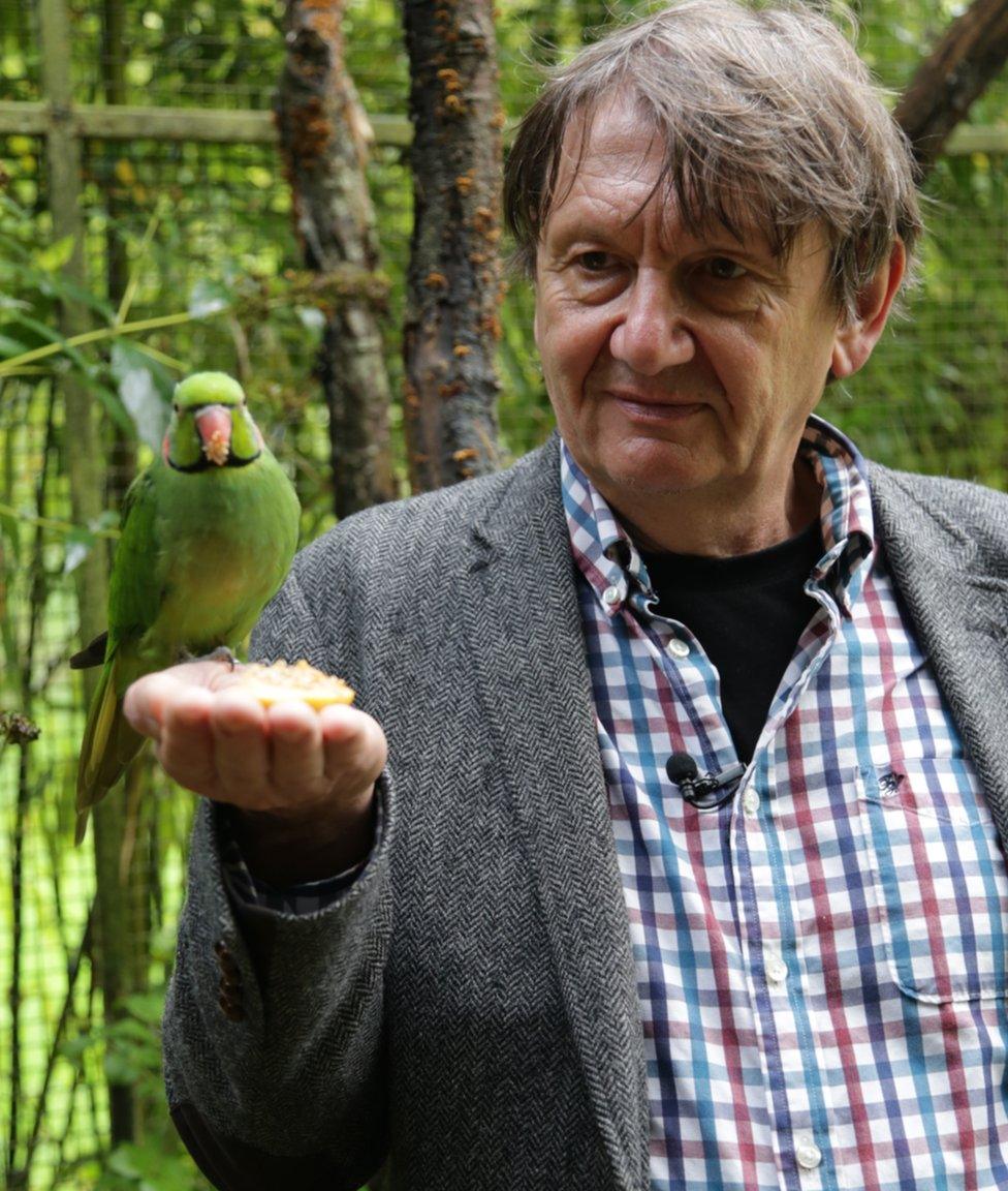 Carl Jones with an echo parakeet