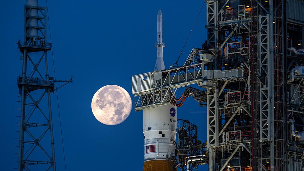 top of rocket with Moon in background