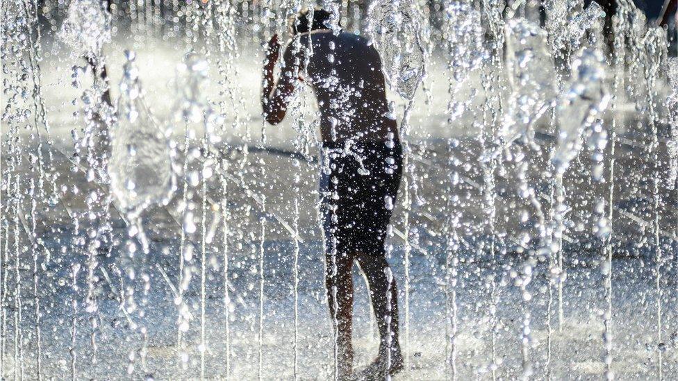 Boy in fountain