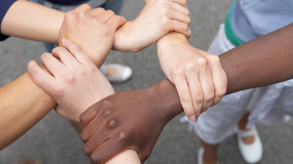 Children linking hands