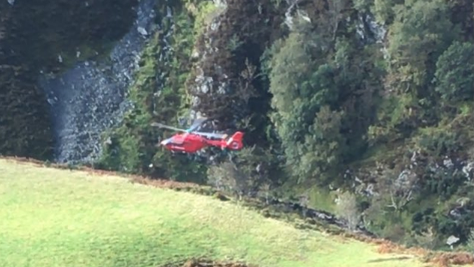 An air ambulance leaving the scene of the crash