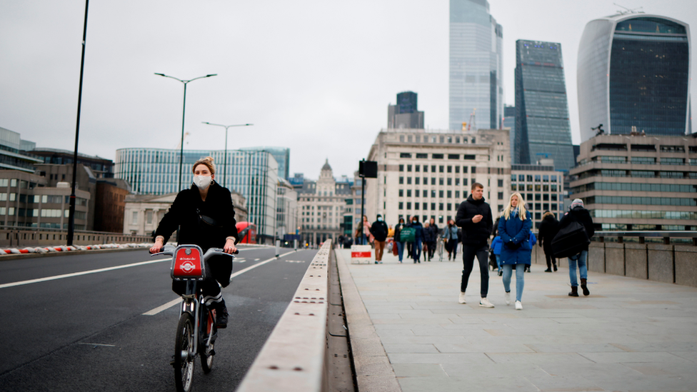 cyclist on a bridge in London