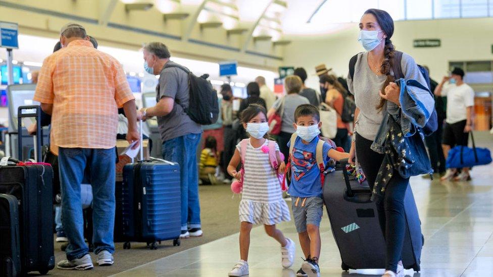 Passengers at John Wayne Airport in Santa Ana, CA