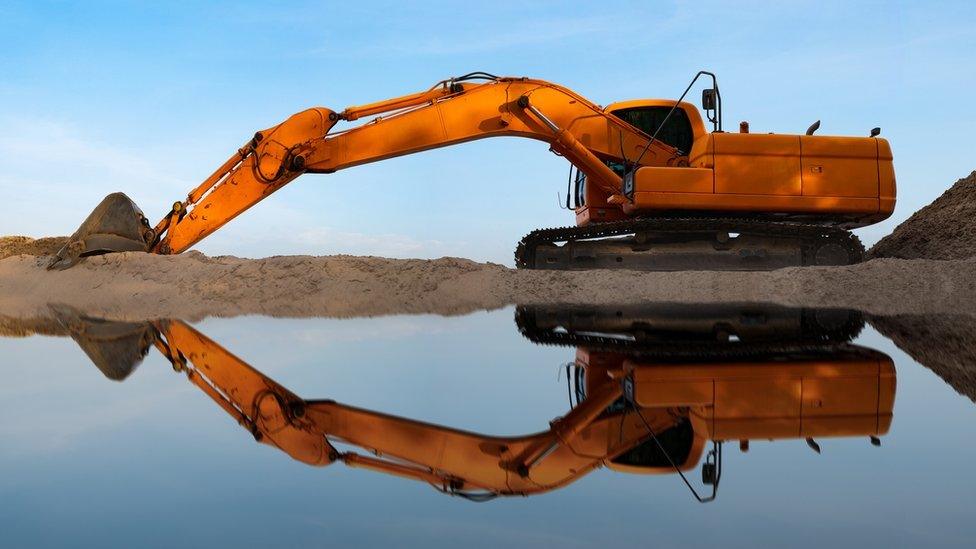 Sand being extracted from a river in Thailand