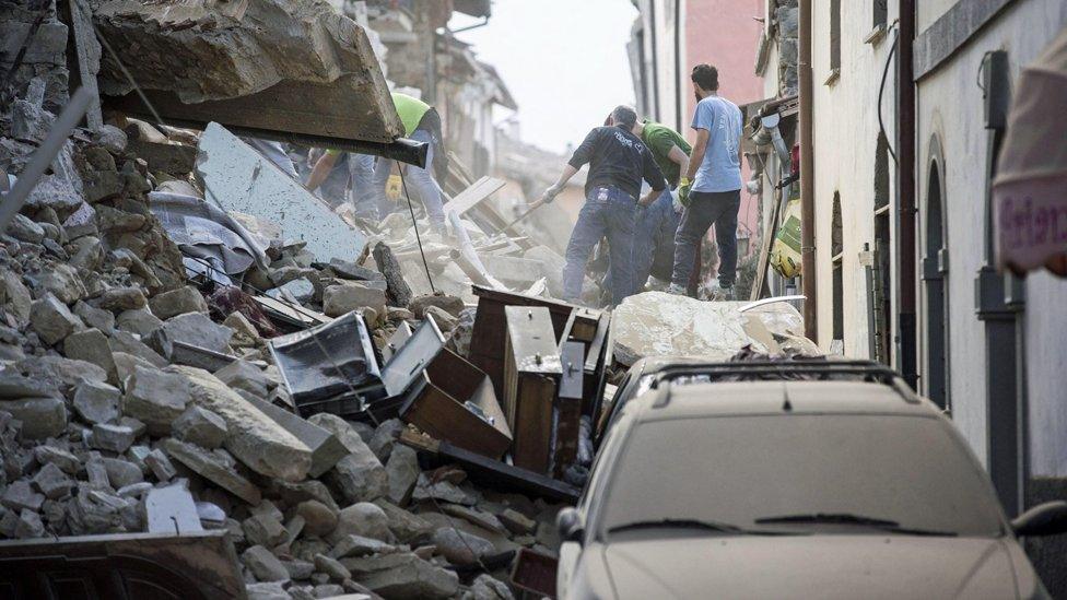 Rescue teams search through collapsed buildings in Amatrice, central Italy, following a 6.2 magnitude earthquake - 24 August 2016