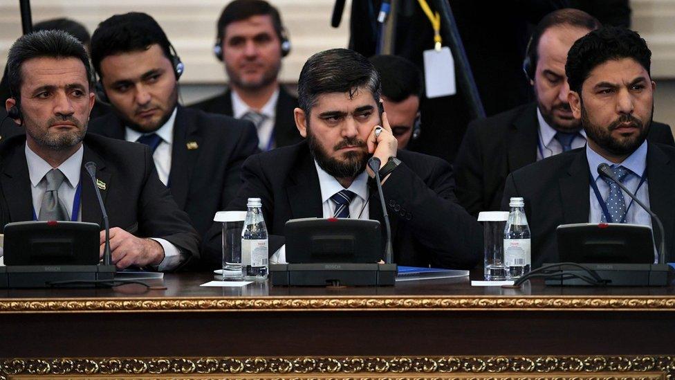 Mohammed Alloush (centre) and other members of Syrian rebel delegation at talks with government in Astana, Kazakhstan (23 January 2017)