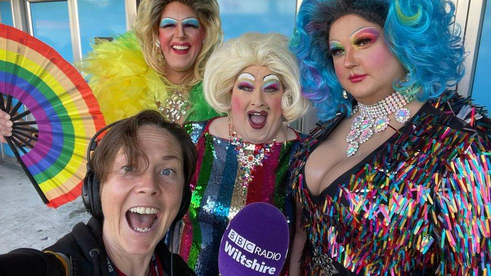 ý Radio Wiltshire's Kelly Morgan pictured with three drag queens