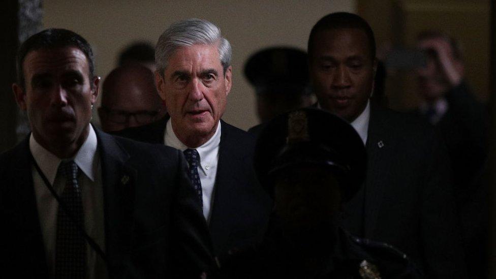 Robert Mueller walks through the halls of Congress.