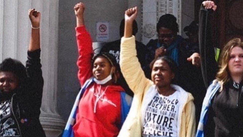 Women with fist in air