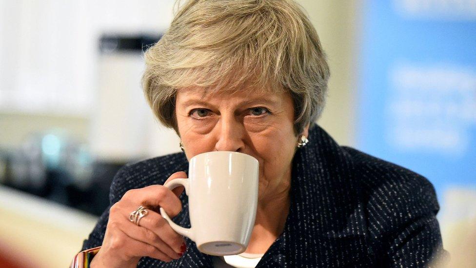 Theresa May drinking