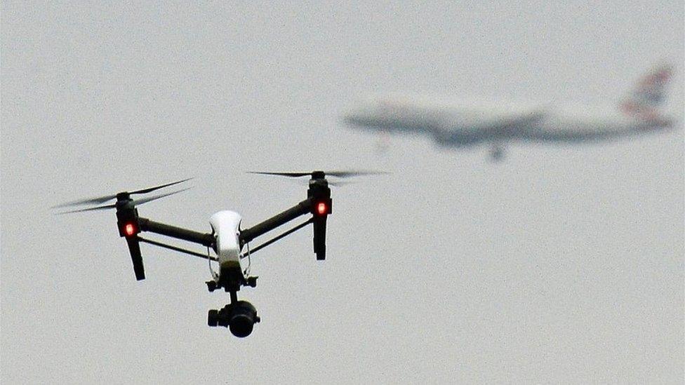 A drone flying near an aircraft