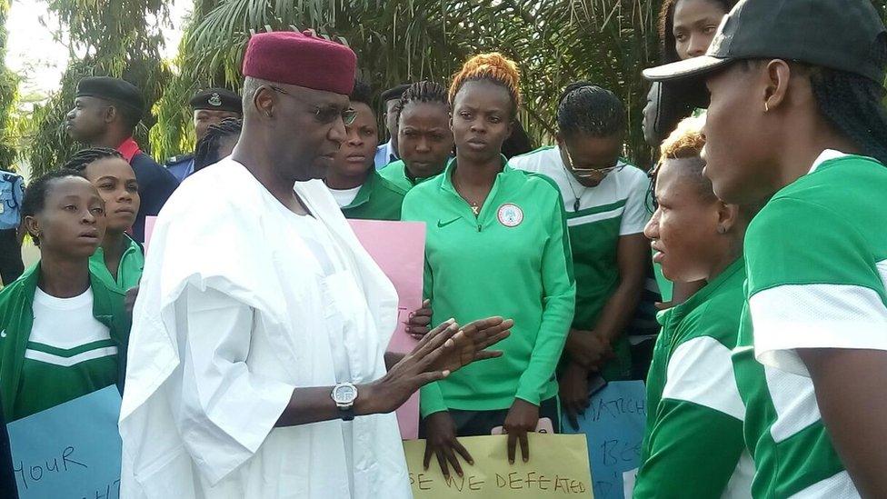 Malam Abba Kyari, the President's chief of staff, talking to the Super Falcons outside the presidential villa