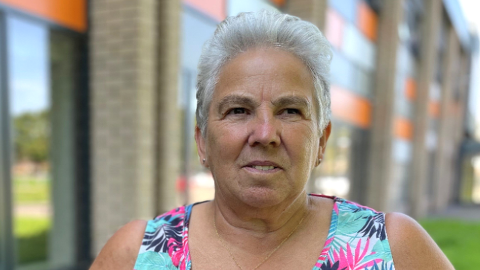 Sheila Mott and the defib she uses to train colleagues at the leisure centre