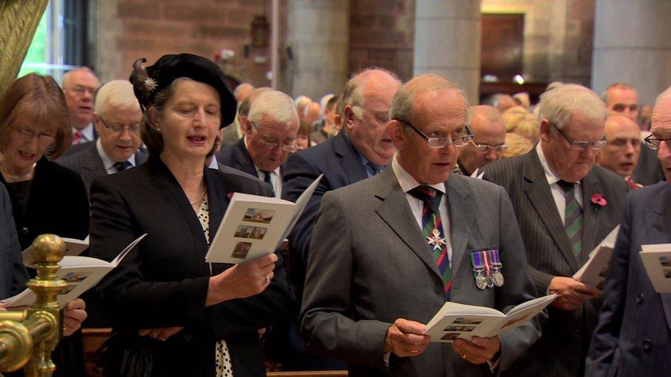 The congregation sings during the service