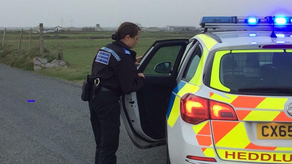 A police officer at Caernarfon Airport