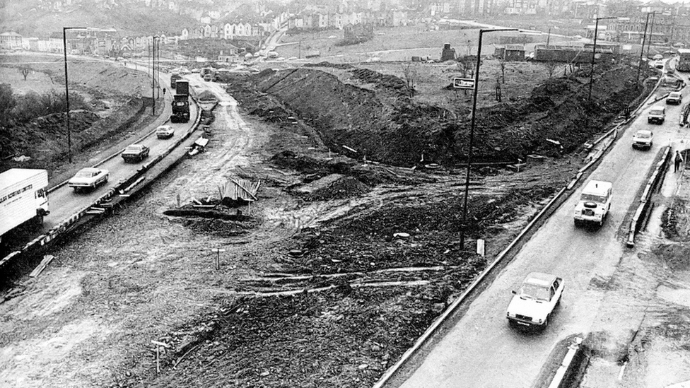 Demolished buildings around road junction