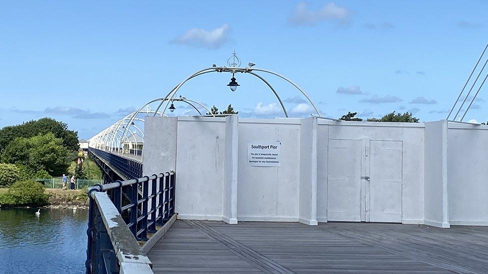 Southport Pier with boards across to show it's closed