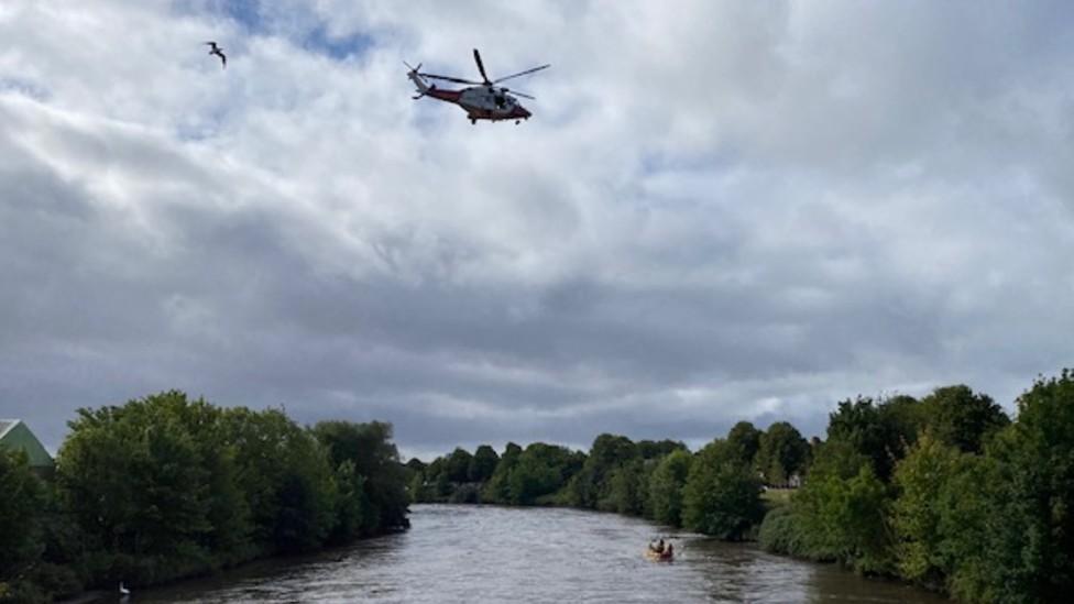 Helicopter in sky above River Taff