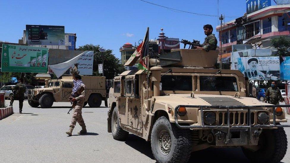 Afghan security forces sit in a Humvee vehicle amid ongoing fighting between Taliban militants and Afghan security forces in Kunduz on May 19, 2020