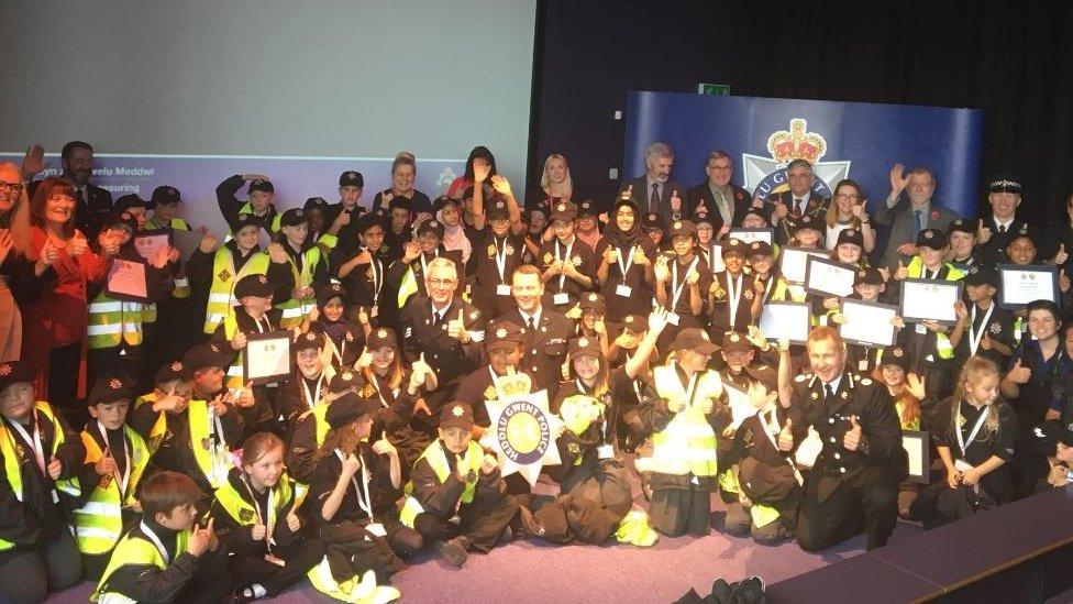 Officers congratulate the Mini Police