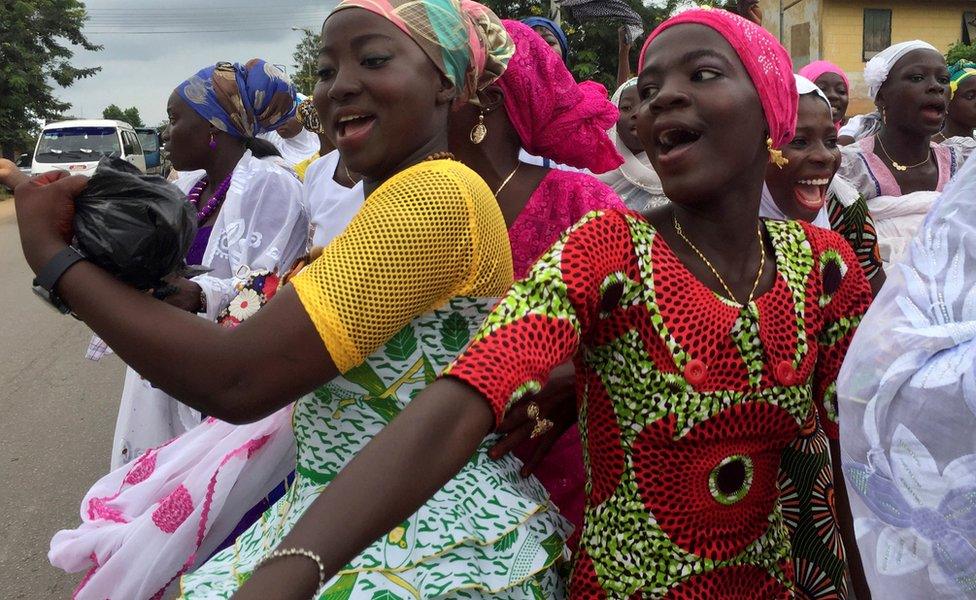 Muslim women dance as they parade through their small town, Assin Foso, in Ghana"s Central Region to celebrate Eid al-Fitr July 6, 2016. Picture taken July 6