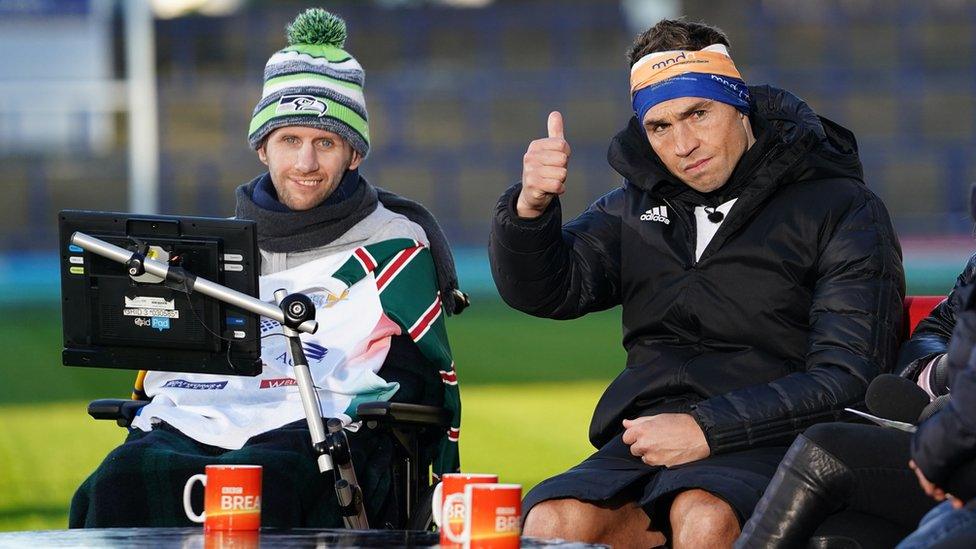 Kevin Sinfield puts his thumb up, sat alongside Rob Burrow