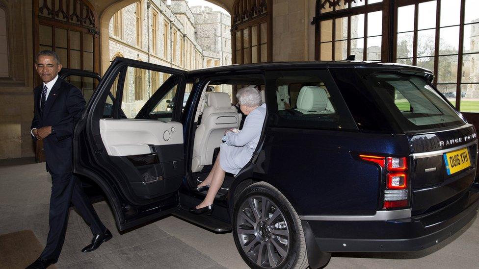 Queen climbing out of the car