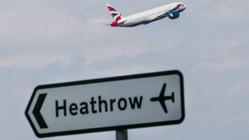 A Heathrow sign and an aeroplane