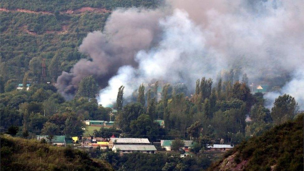 Smoke billows out from inside an Indian Army base which was attacked by suspected militants in Uri, some 115 west of Srinagar, the summer capital of Indian Kashmir, 18 September 2016.