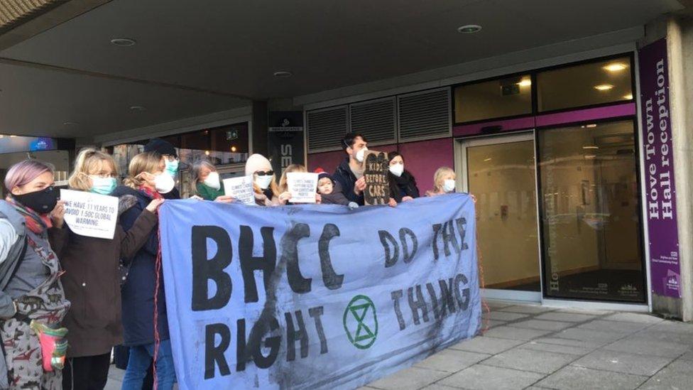 Extinction Rebellion activists protest outside Hove Town Hall.