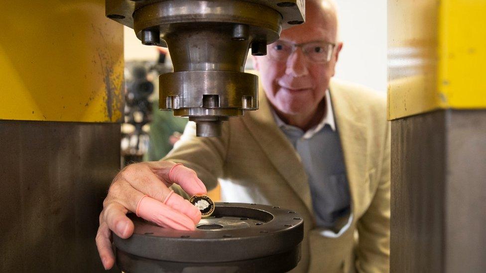 Richard Woodman-Bailey with the newly minted coin