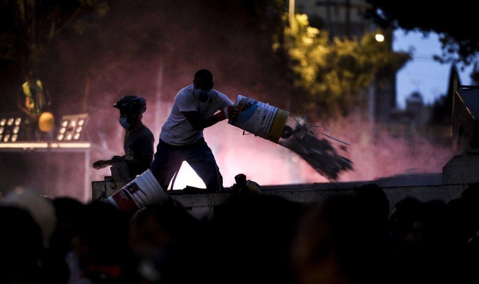 Man clearing rubble in the dark in Mexico City after the devastating earthquake struck on 19 September 2017