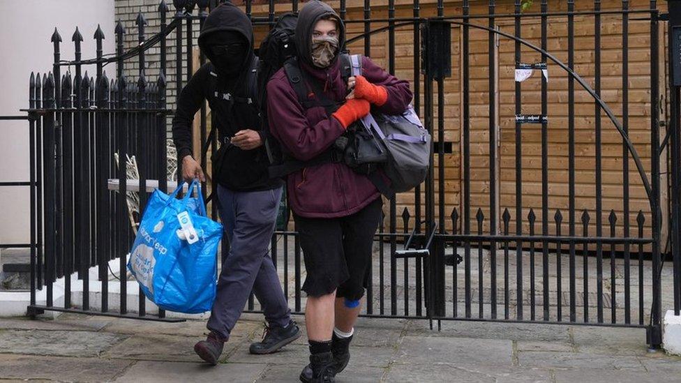 Two squatters leaving Gordon Ramsay's pub